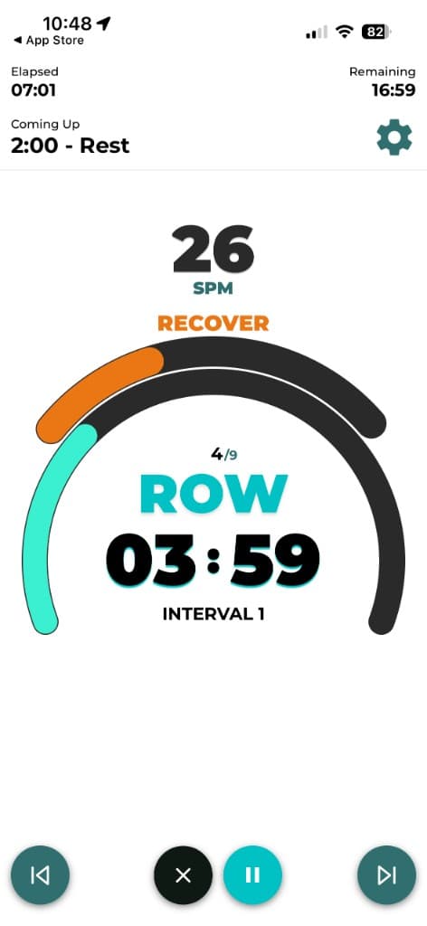 Live rowing workout screen with SPM target, interval timer, and row recover guidance