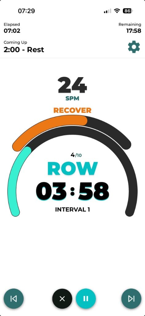 Live rowing workout screen with SPM target, interval timer, and row recover guidance
