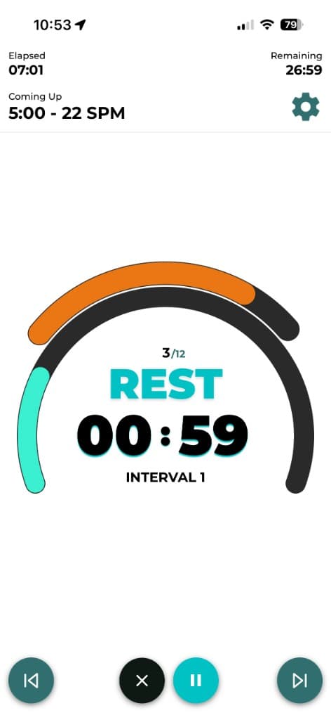 Live rowing workout screen with SPM target, interval timer, and row recover guidance