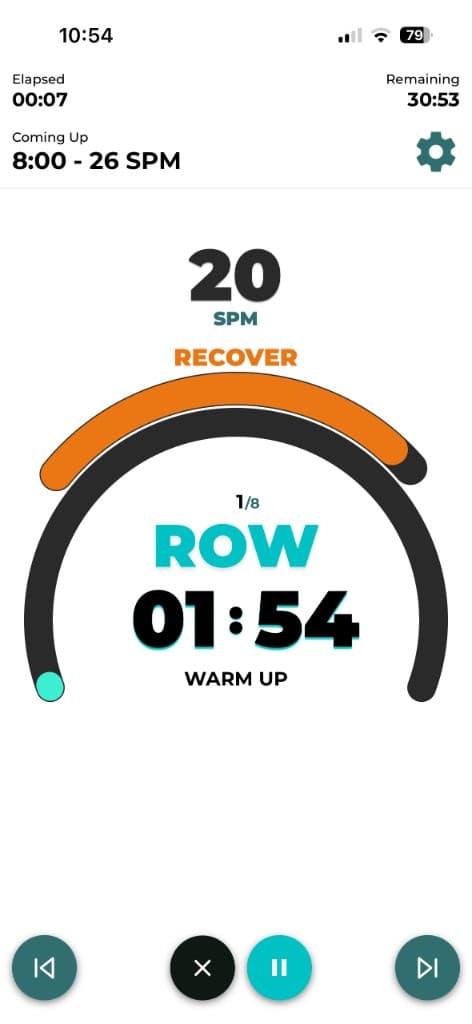 Live rowing workout screen with SPM target, interval timer, and row recover guidance